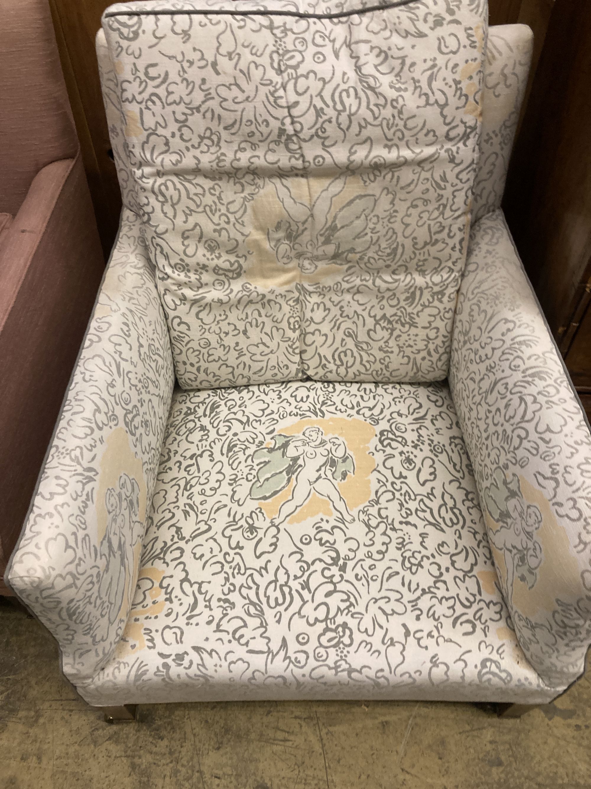 A pair of Edwardian Howard & Son upholstered square framed armchairs with stamped legs and casters, width 69cm, depth 70cm, height 78cm